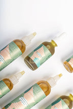 Herbal hair oil duo for scalp care, hair growth, and frizz control